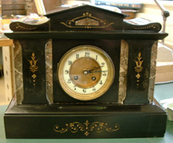 A French Black 'Marble' Clock.