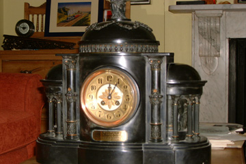 A French Black 'Marble' Clock.