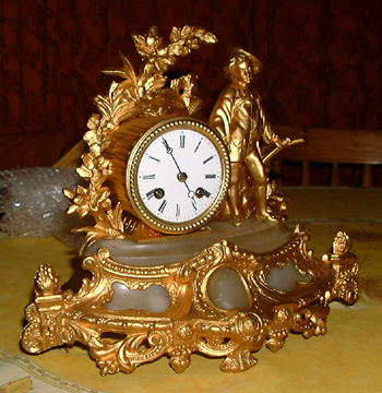 A French Gilt and Alabaster Mantel Clock.